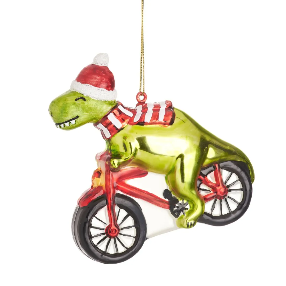 Dinosauruksen joulupallo polkupyörällä